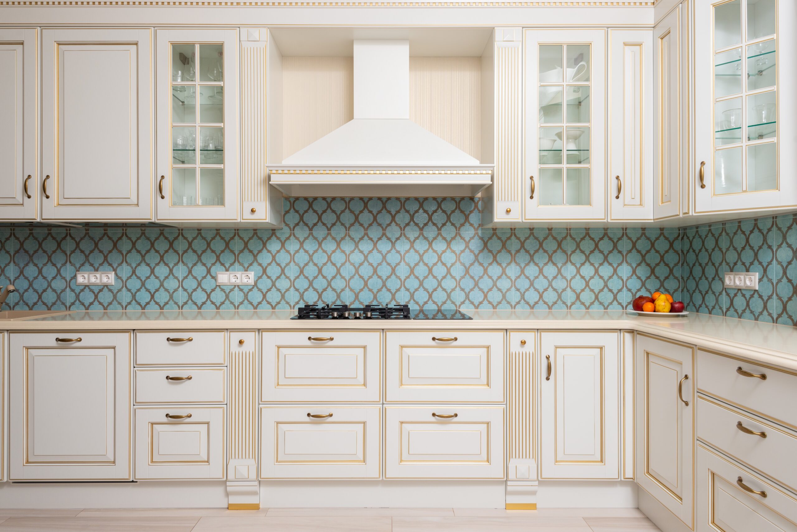 A neutral kitchen space with white woodwork.